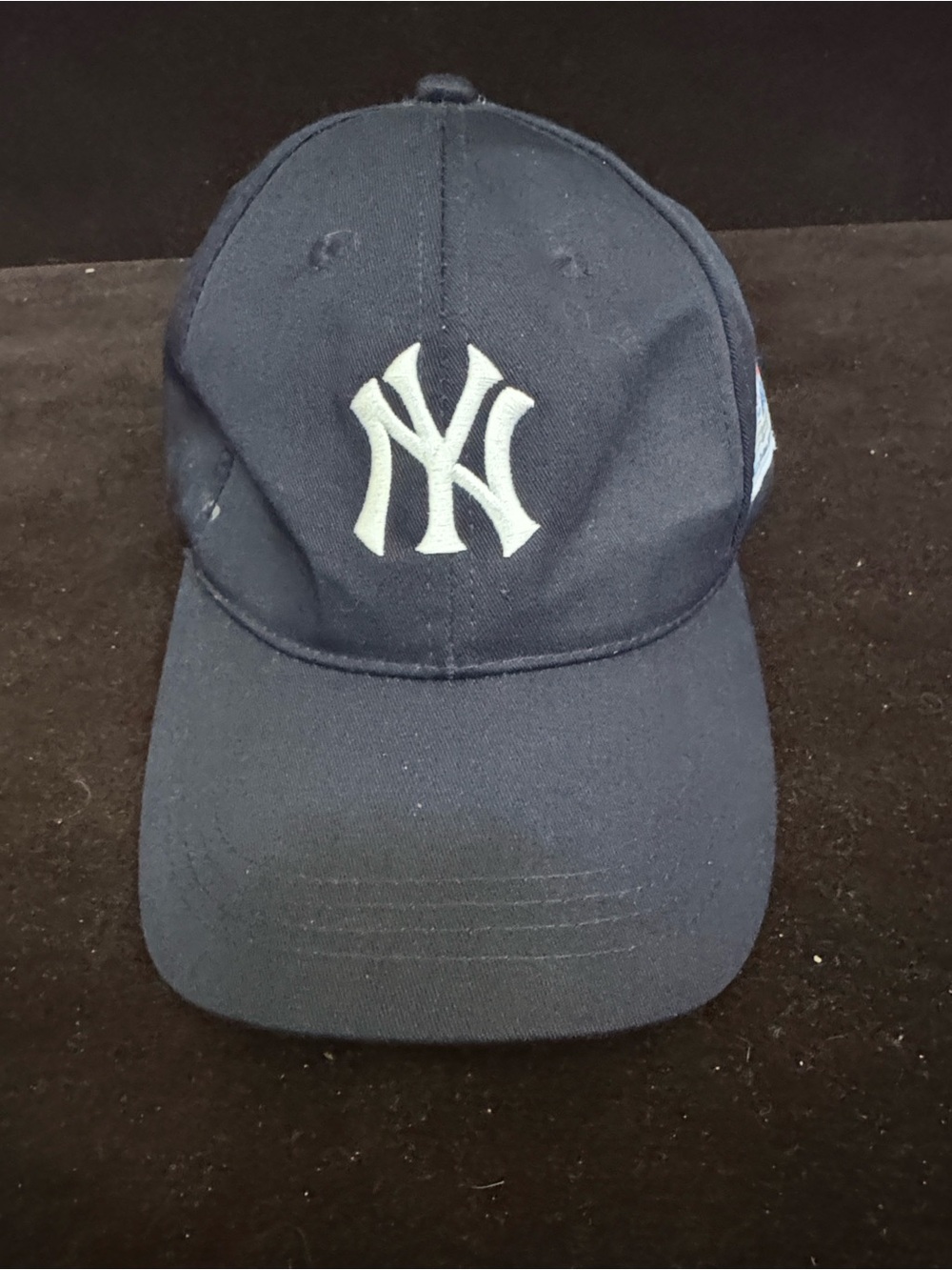 New York Yankees baseball cap featuring a promotional patch for WFAN